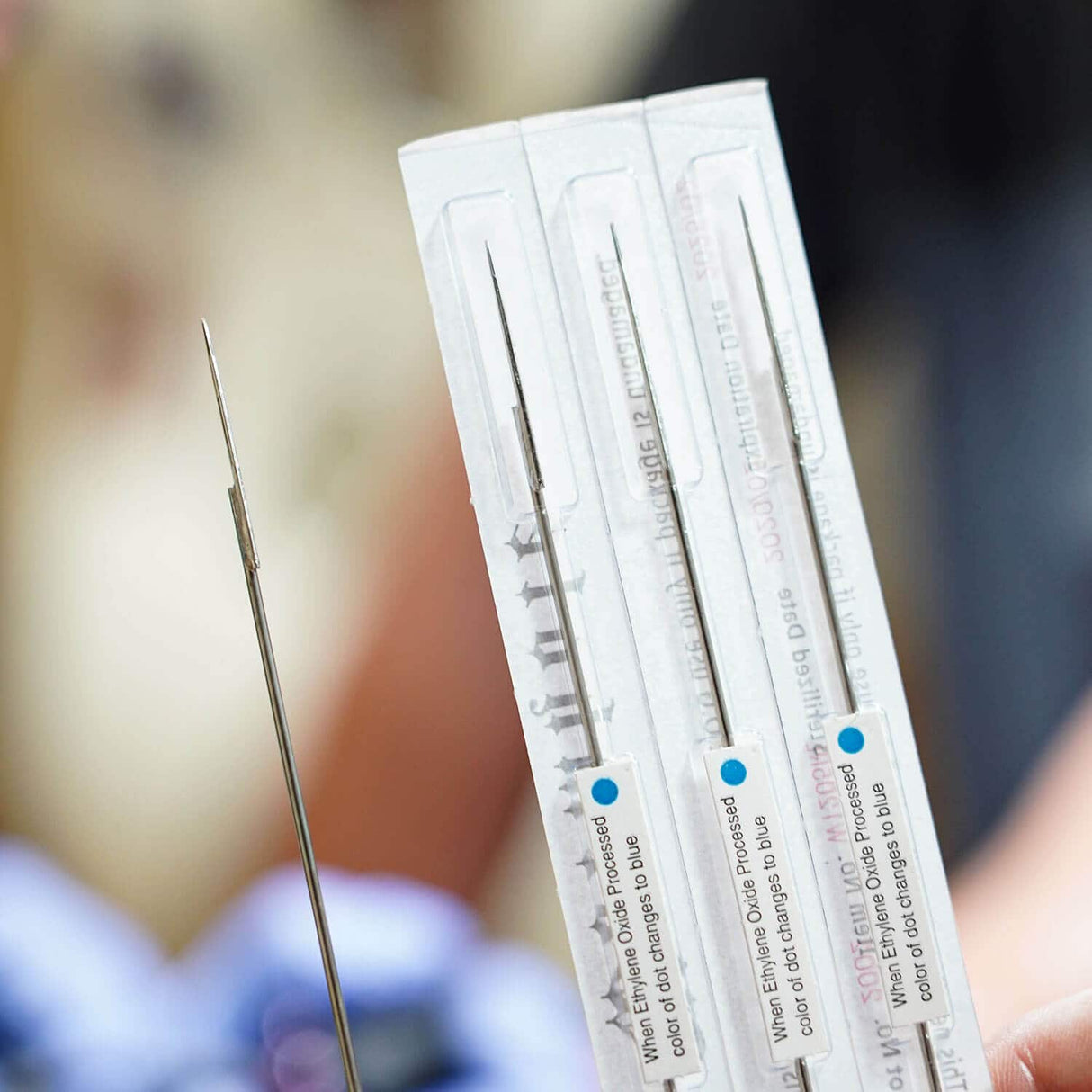 Tattoo needle with blue dot