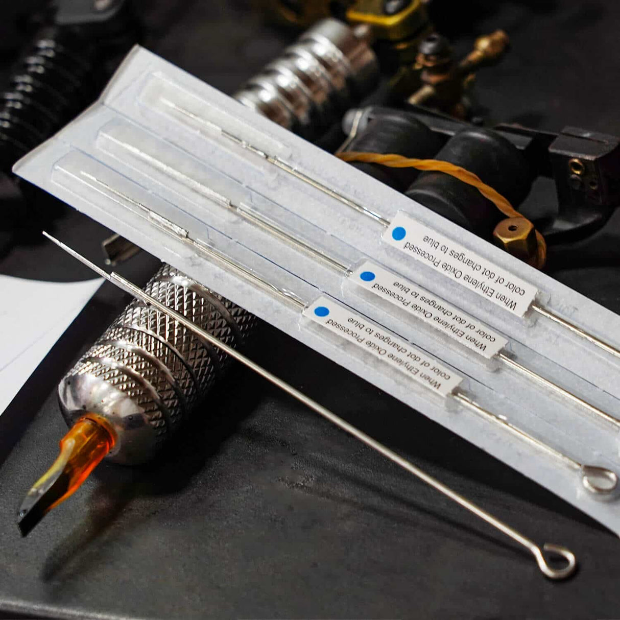 Tattoo needle with blue dot