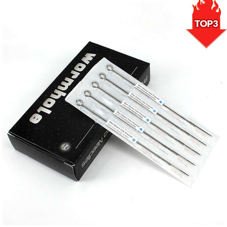 tattoo needles with blue dot